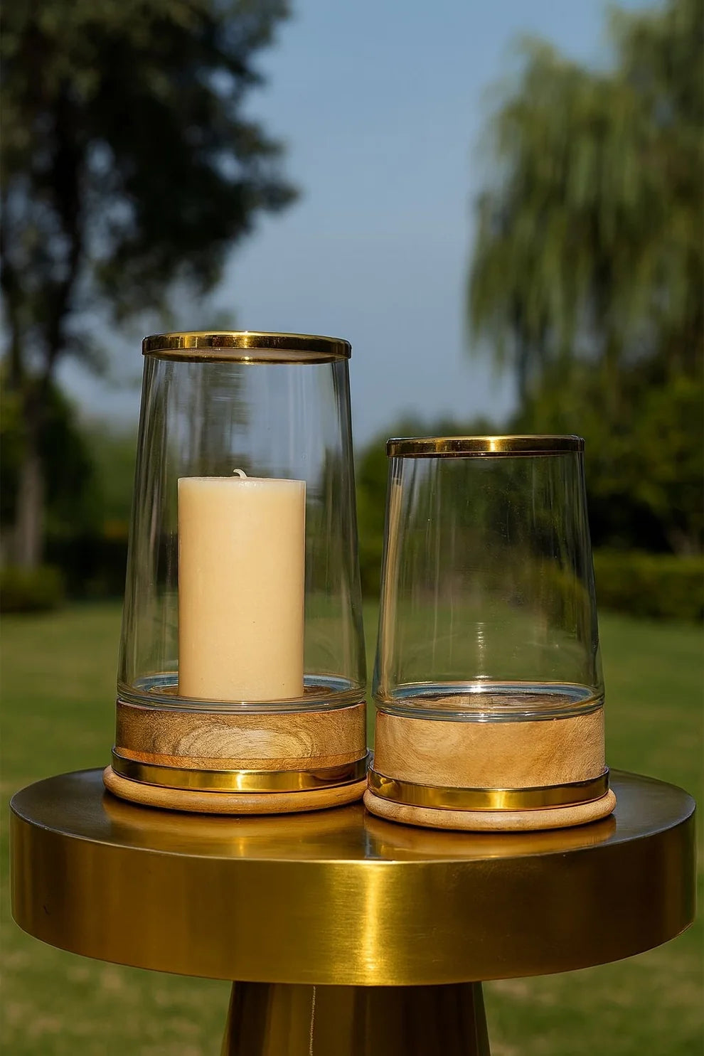 GLASS HURRICANE WITH BRASS BANDS AND WOOD BASE LARGE, 26 x1 6.5cm.