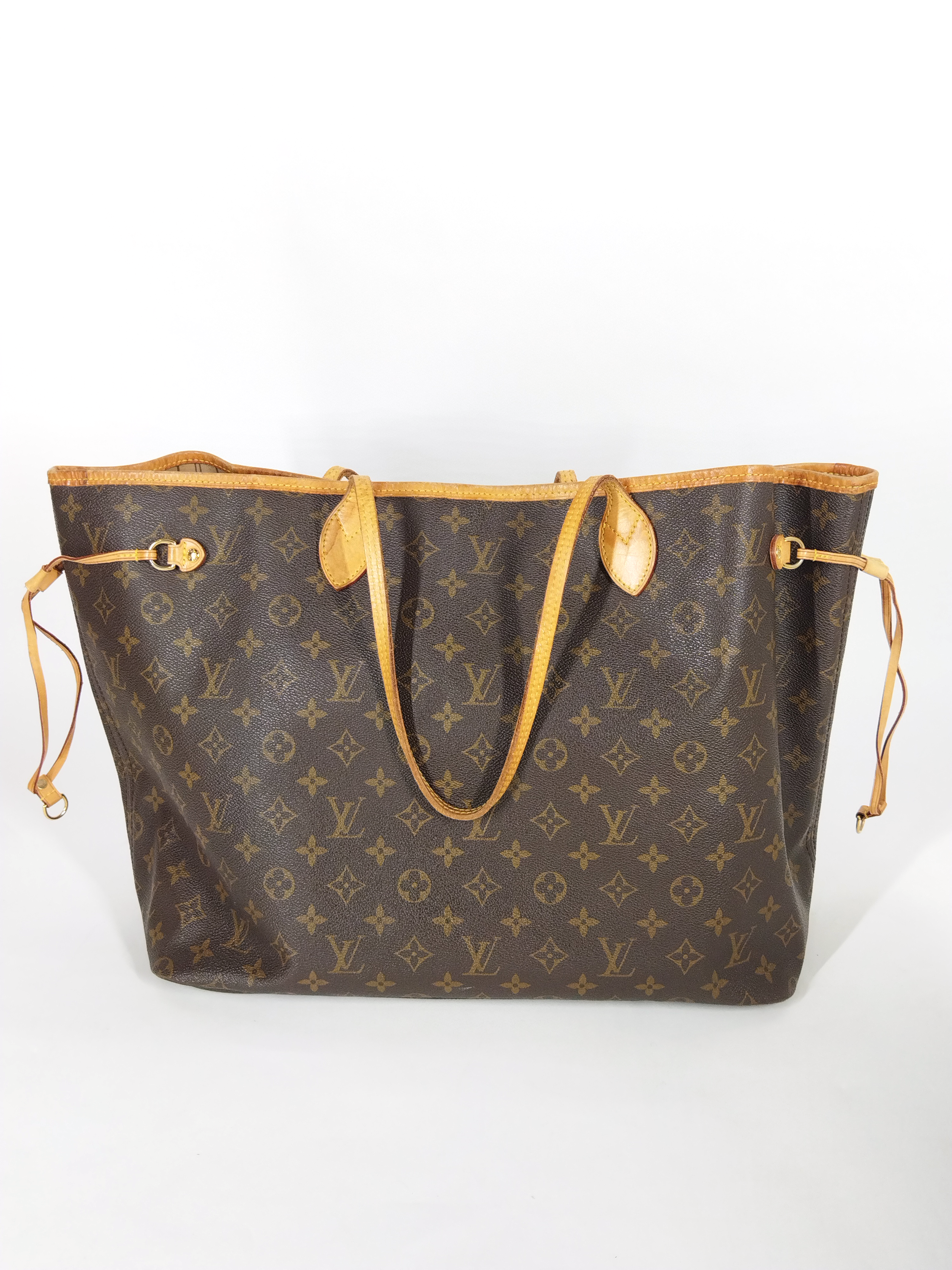 Gold textured louis vuitton neverfull purse with lv logo