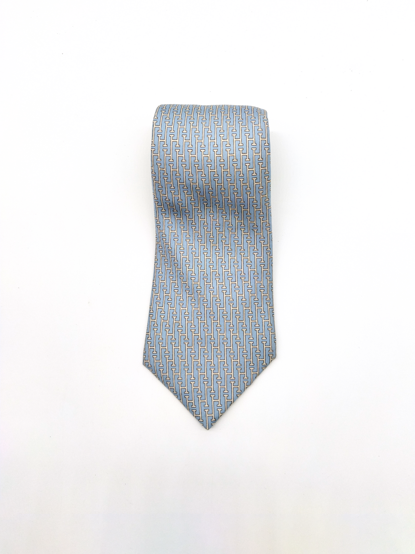 HERMÈS SILK TIE, LIGHT BLUE WITH INTERLINKED 'H' PATTERN.