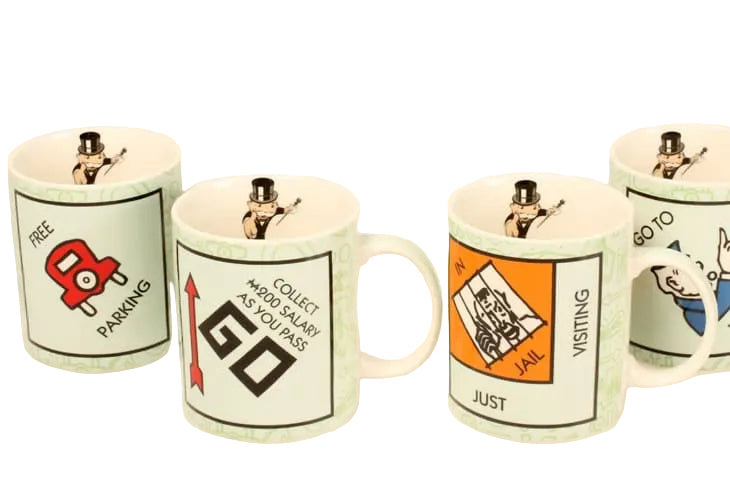 MONOPOLY NOVELTY MUG, FEATURING IMAGES OF THE CORNERS OF THE MONOPOLY BOARD, HEIGHT 9.5cm. $25.00 Each