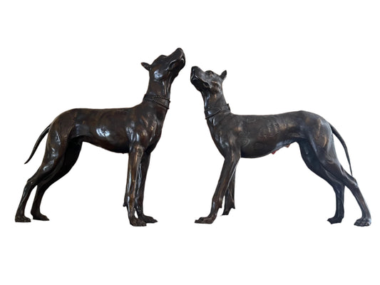 A PAIR OF IMPRESSIVE PATINATED BRONZE DOBERMAN PINSCHER'S, SIGNED, 57 x 50cm.