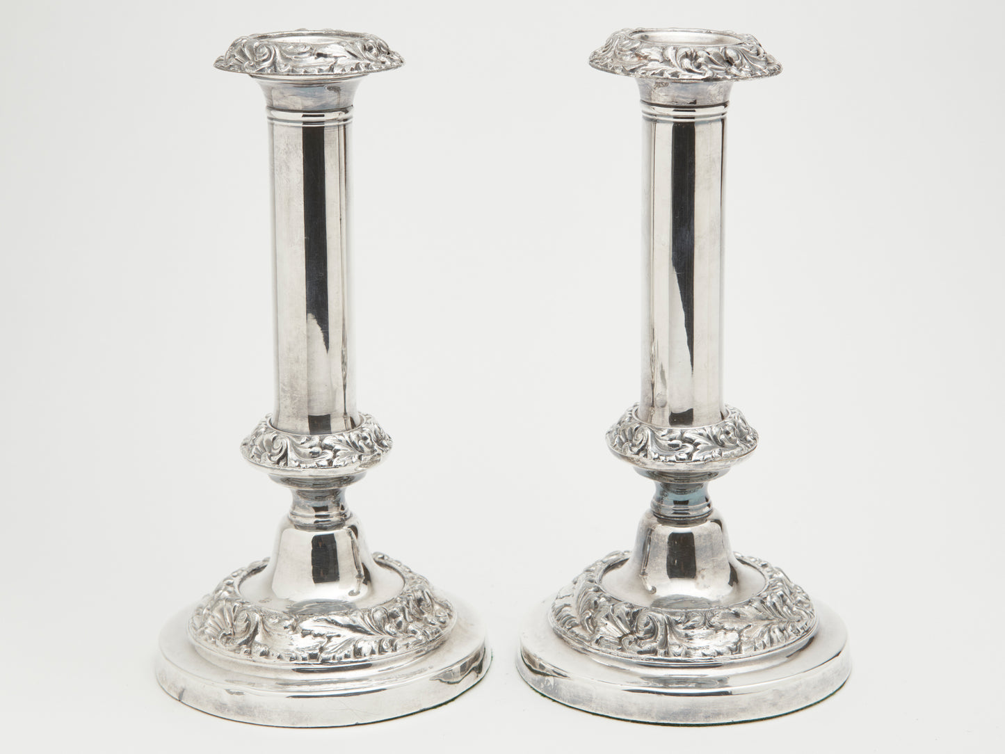 A PAIR OF VICTORIAN CANDLE STICKS
