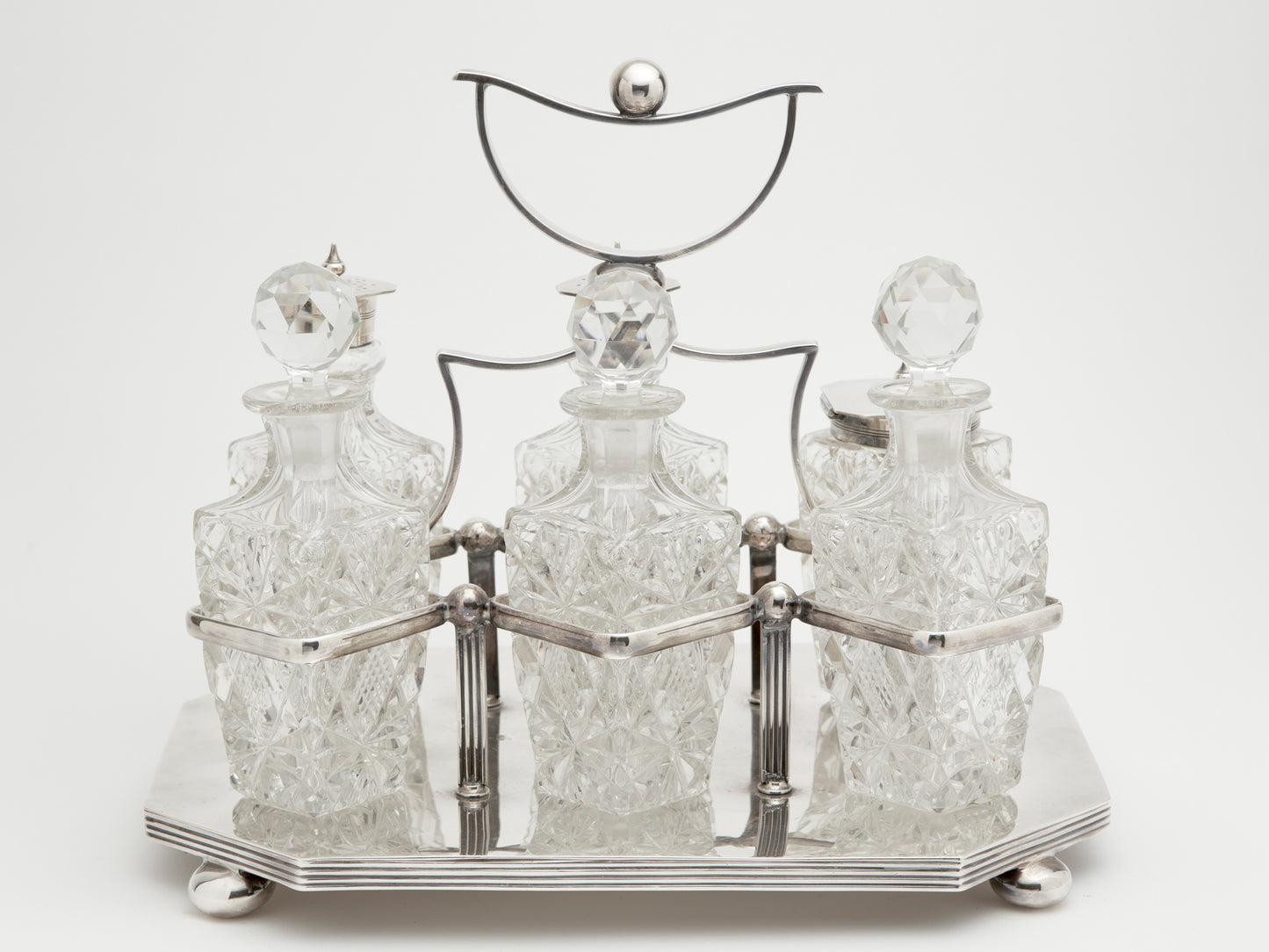 AN ANTIQUE CRUET SET