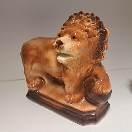 STAFFORDSHIRE FIGURE, LANCHESTER & SONS Ltd, ENGLAND, SCOTTISH STANDING LION WITH GLASS EYES AND BALL, EARLY 20th CENTURY.