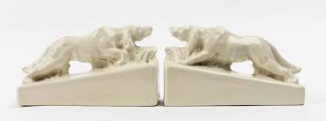 A PAIR OF AUSTRALIA CERAMIC ‘ATHOLL’  BOOKENDS, EACH MODELLED AS AN IRISH SETTER, CIRCA 1955, ARTIST CLAUDE REGINALD HOSE, 14 x 22 x 8cm..