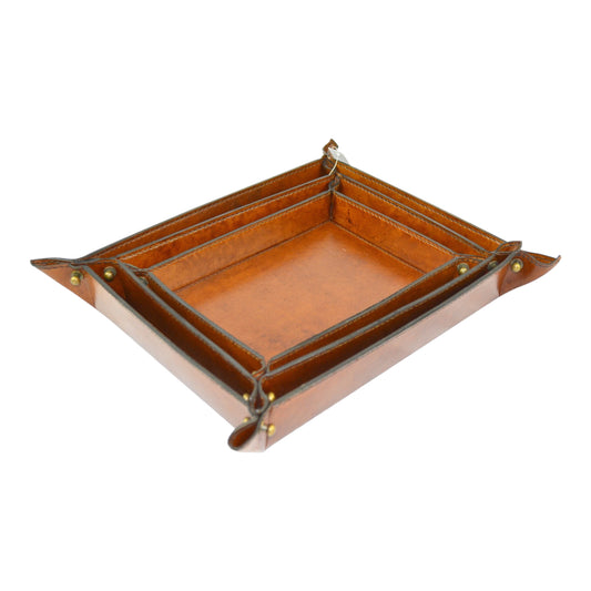 SET OF THREE 'VIDE POCHE - MUST HAVE' TRAYS, HAND CRAFTED IN DARK TAN LEATHER, LARGEST 18 x 23 x 5cm.