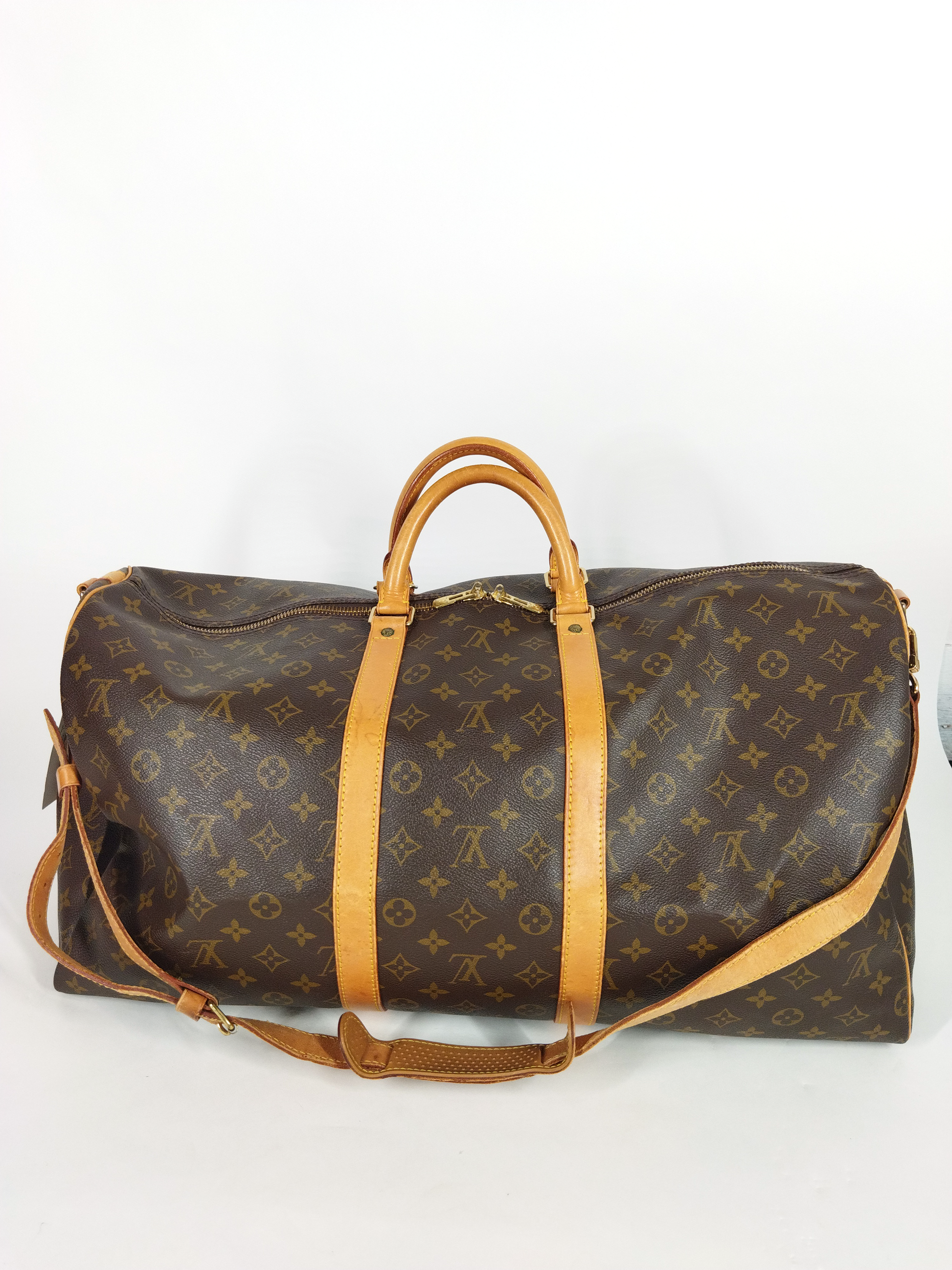 LOUIS VUITTON, Keepall Bandouliere 60 Travel bag in Brown Monogram Can –  The House of Marcelle and Mr John