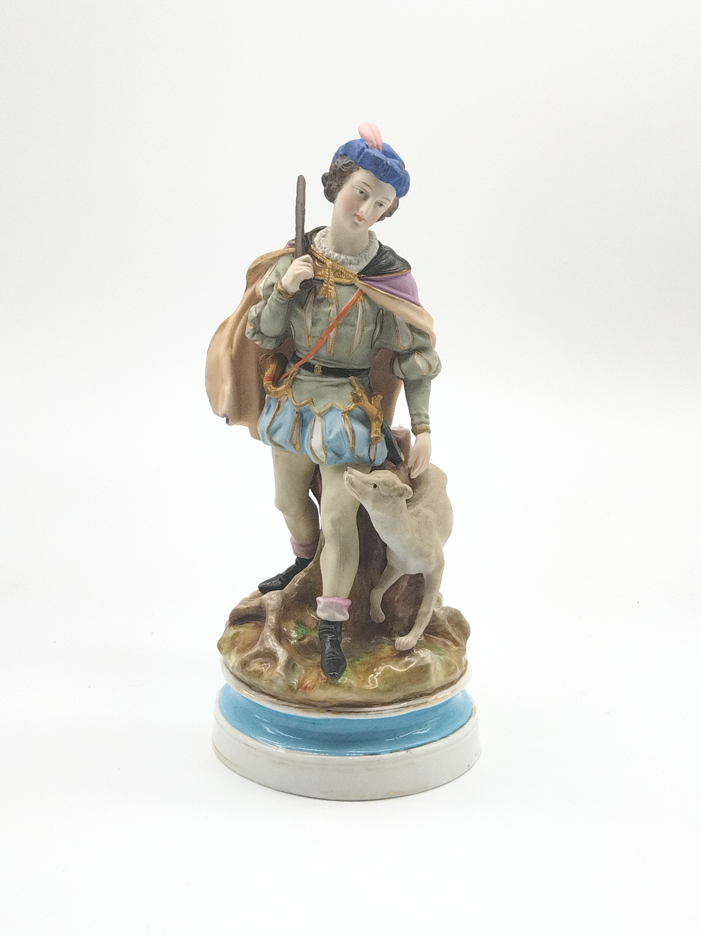 A CONTINENTAL FIGURE OF A MAN WITH HIS DOG, 19TH CENTURY, HEIGHT 31cm.