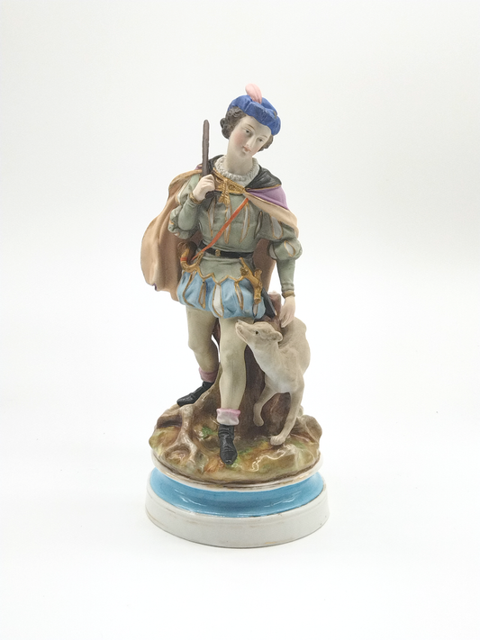 A CONTINENTAL FIGURE OF A MAN WITH HIS DOG, 19TH CENTURY, HEIGHT 31cm.
