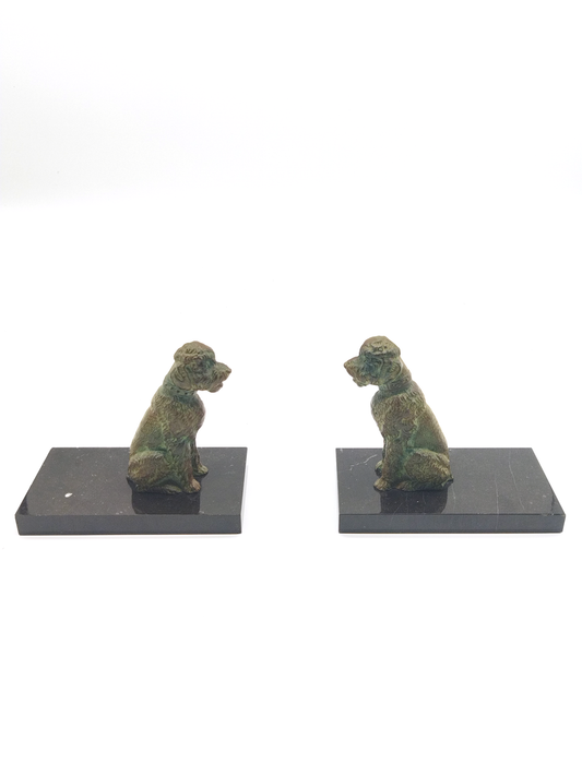 A PAIR OF BRONZE ART DECO POODLES BOOKENDS ON BLACK MARBLE BASES, 14 x 15 x 8cm.