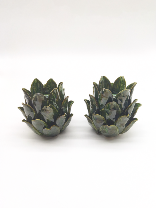 A PAIR OF GREEN CERAMIC ARTICHOKE TEA CANDLE HOLDERS, HEIGHT 15cm.