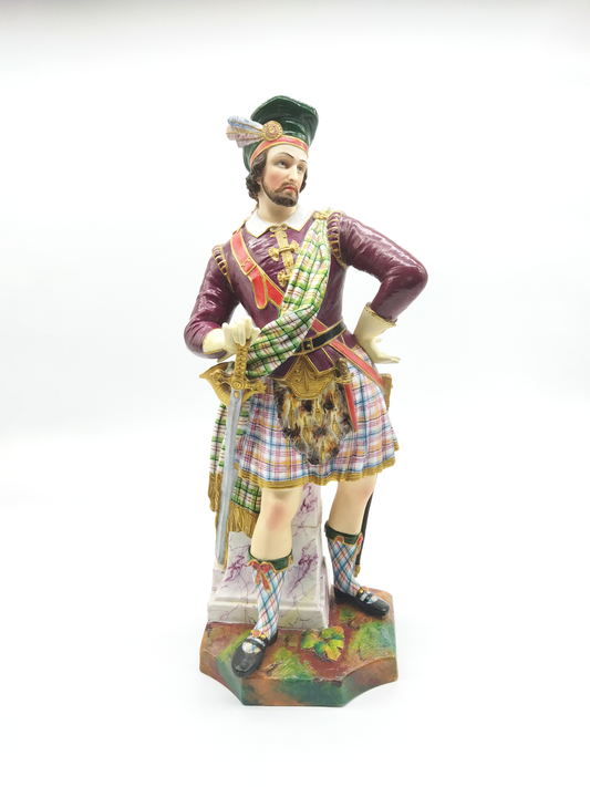 A POLYCHROME FIGURE OF A SCOTSMAN, LATE 19th CENTURY.