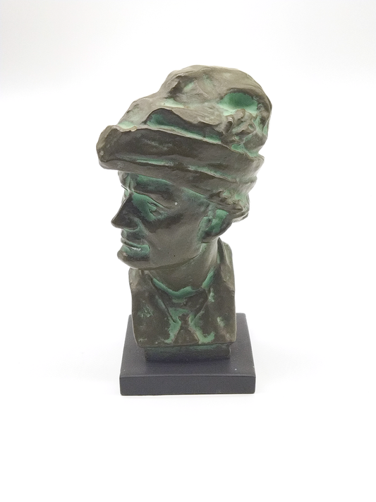 A SIGNED SCULPTURE BUST OF A MAN, WITH AGED BRONZE FINISH,DATED 1947, HEIGHT 24cm.