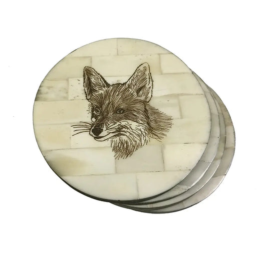 A SET OF FOUR FOX HEAD SCRIMSHAW BONE COASTERS, DIAMETER 10cm