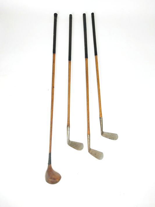 SET OF FOUR VINTAGE GOLF CLUBS