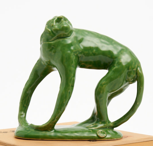 A JAPANESE CERAMIC GREEN GLAZED MONKEY FIGURE, SIGNED AND BOXED H.20CM