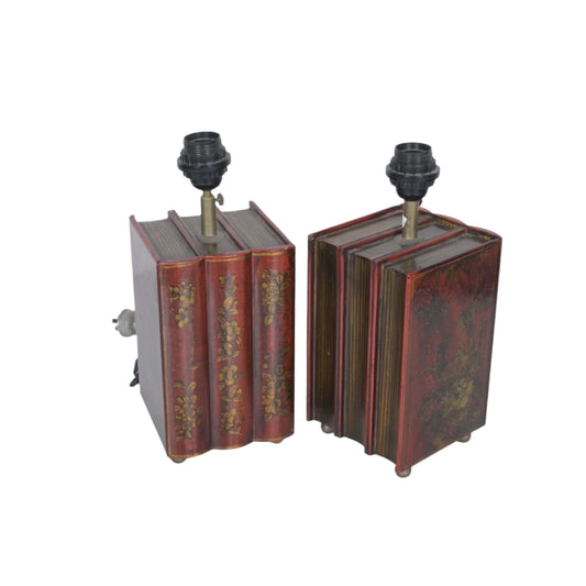 A PAIR OF TABLE LAMPS, THE BASE IN A FORM OF BOOK BINDINGS - NO SHADES (36CM H X 15CM W)