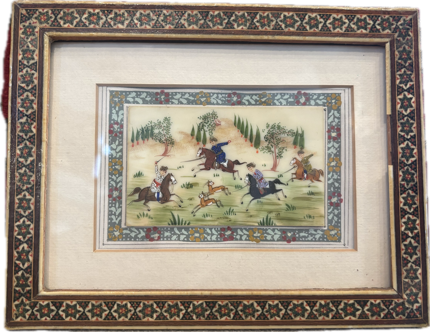 MINIATURE INDIAN MUGHAL HUNTING SCENE, PRESENTED IN A TRADITIONAL INLAID FRAME, 20 x 16cm.