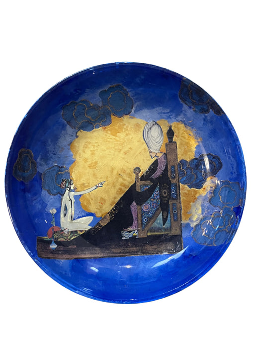 AN ART DECO STYLE DECOUPAGE GLASS CHANGE/ TRINKET DISH DEPICTING ‘SCHEHERAZADE’, DIAMETER 14cm.