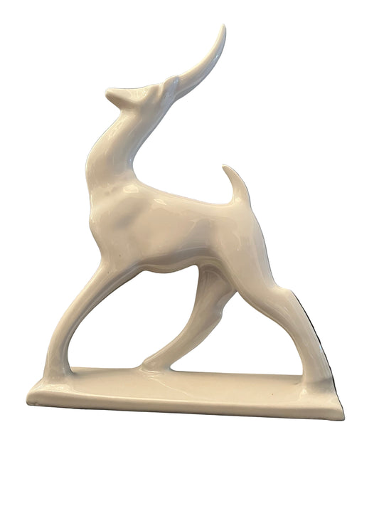 AN ART DECO STYLE BLANC-DE-CINE PORCELIAN GAZELLE FIGURE, HEIGHT 29cm.