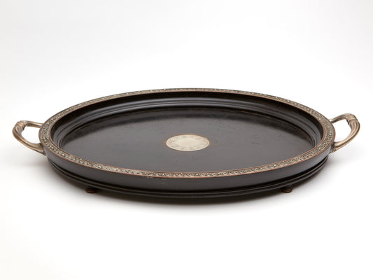 AN ANTIQUE EBONISED AND SILVER TRAY