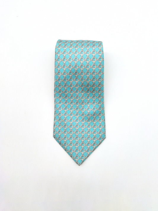 HERMÈS  SILK TIE, TURQUOISE BLUE WITH LINK PATTERN.
