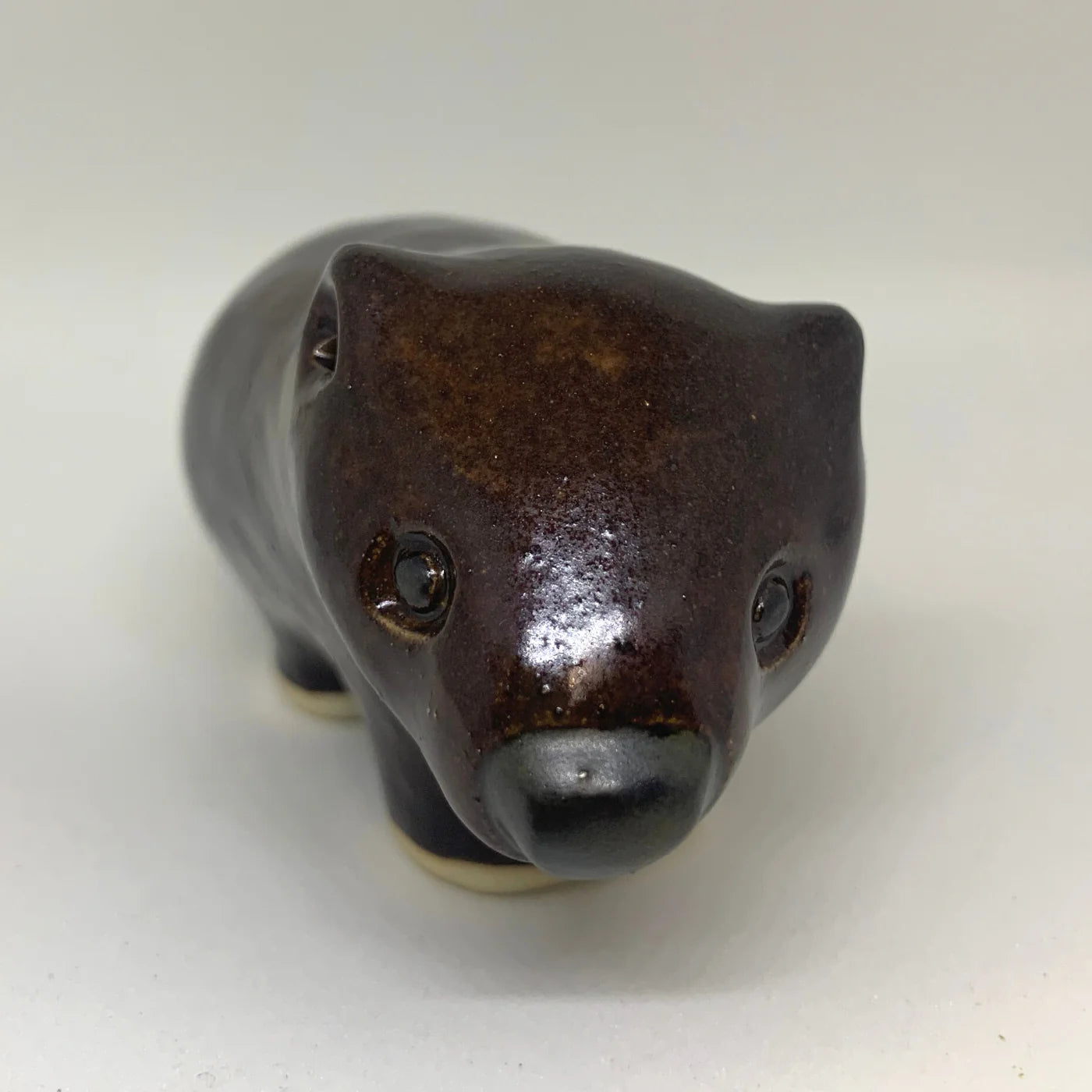 YOONA WELLING DESIGN'S, SLIP CAST, HAND GLAZED CERAMIC WOMBAT, 5 x 4 x 8cm.