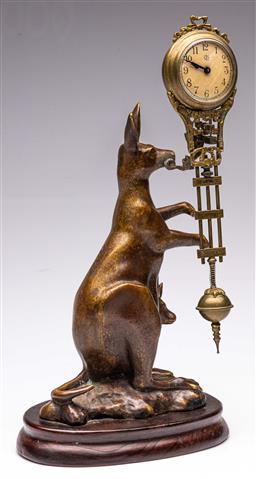 DECORATIVE BRONZE KANGAROO MYSTERY CLOCK ON A WOODEN BASE, HEIGHT 24cm.