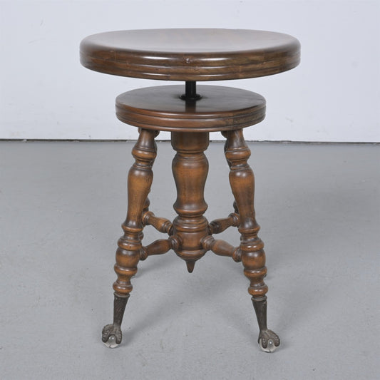 AN AUSTRALIAN CEDAR PIANO STOOL, WITH BRASS EAGLE CLAW AND GLASS BALL FEATURE LEGS, HEIGHT 52CM, WIDTH 37CM.